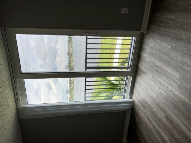 an open window with a tree outside of it