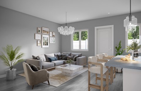 a living room and dining room with grey walls and a table and chairs