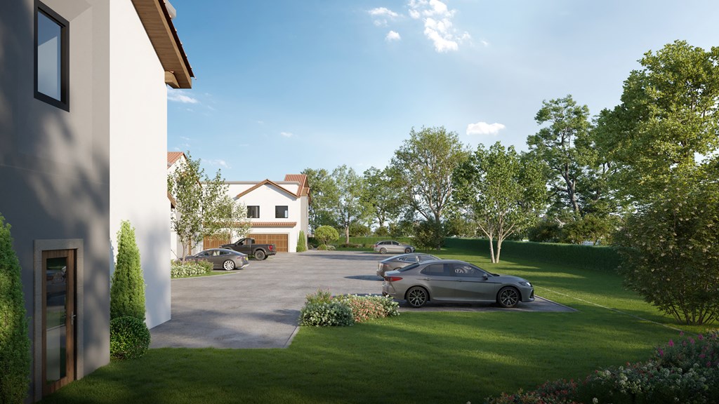 a driveway with cars parked in front of a house