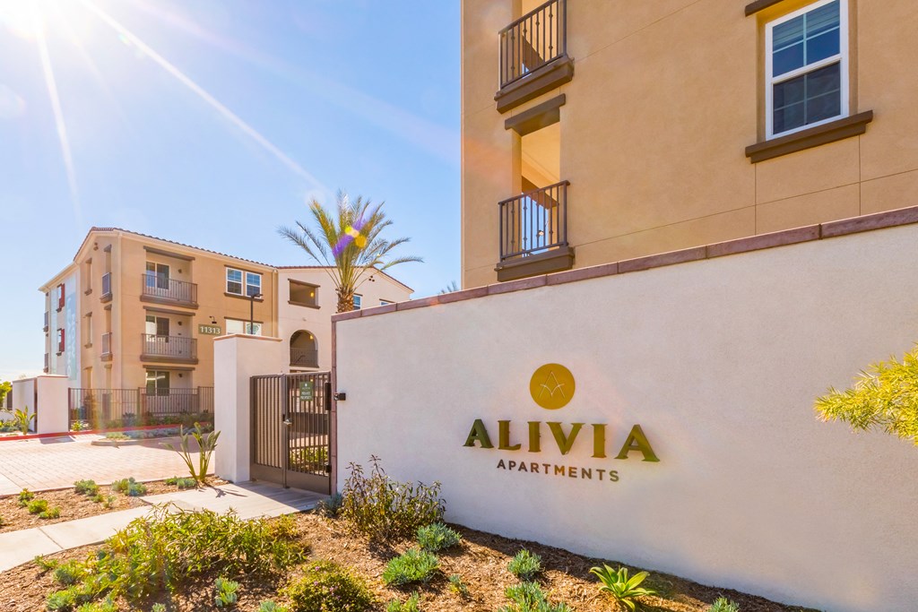 a building with an apartments logo on the side of it