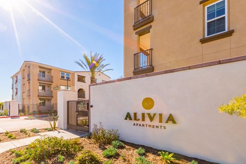 a building with an apartments logo on the side of it