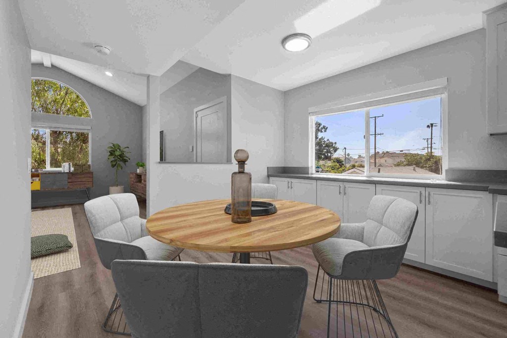 a rendering of a dining room with a table and four chairs