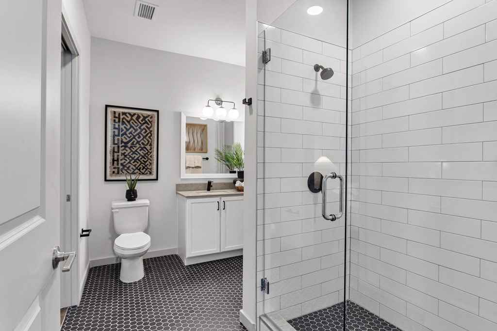 a white bathroom with a shower and a toilet at Casa Marti, Tampa, FL