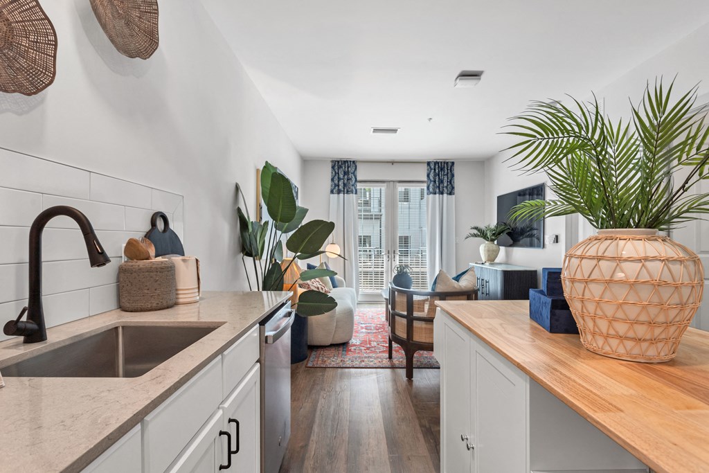 a kitchen with a sink and a view of a living room at Casa Marti, Tampa