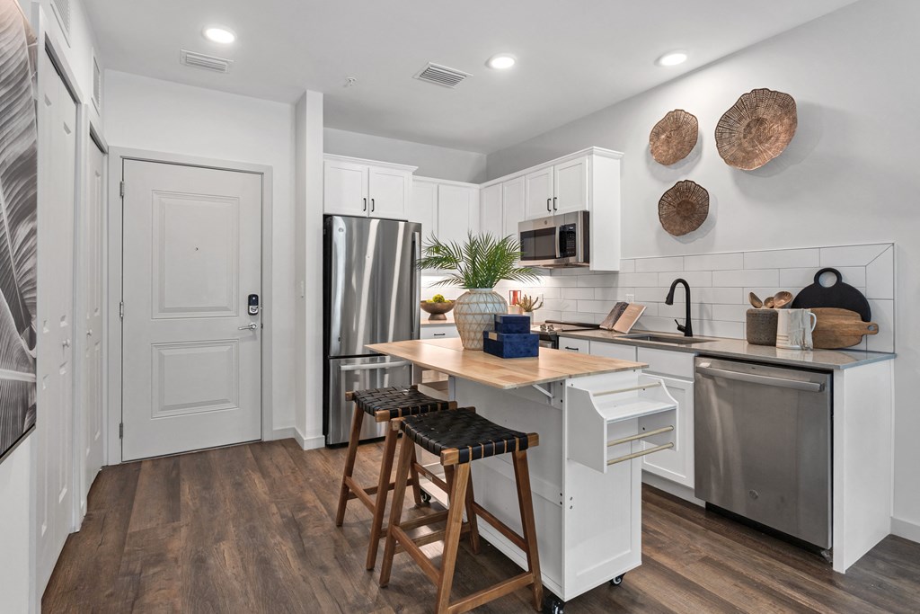 a kitchen with a large island and stainless steel appliances at Casa Marti, Tampa, FL, 33605
