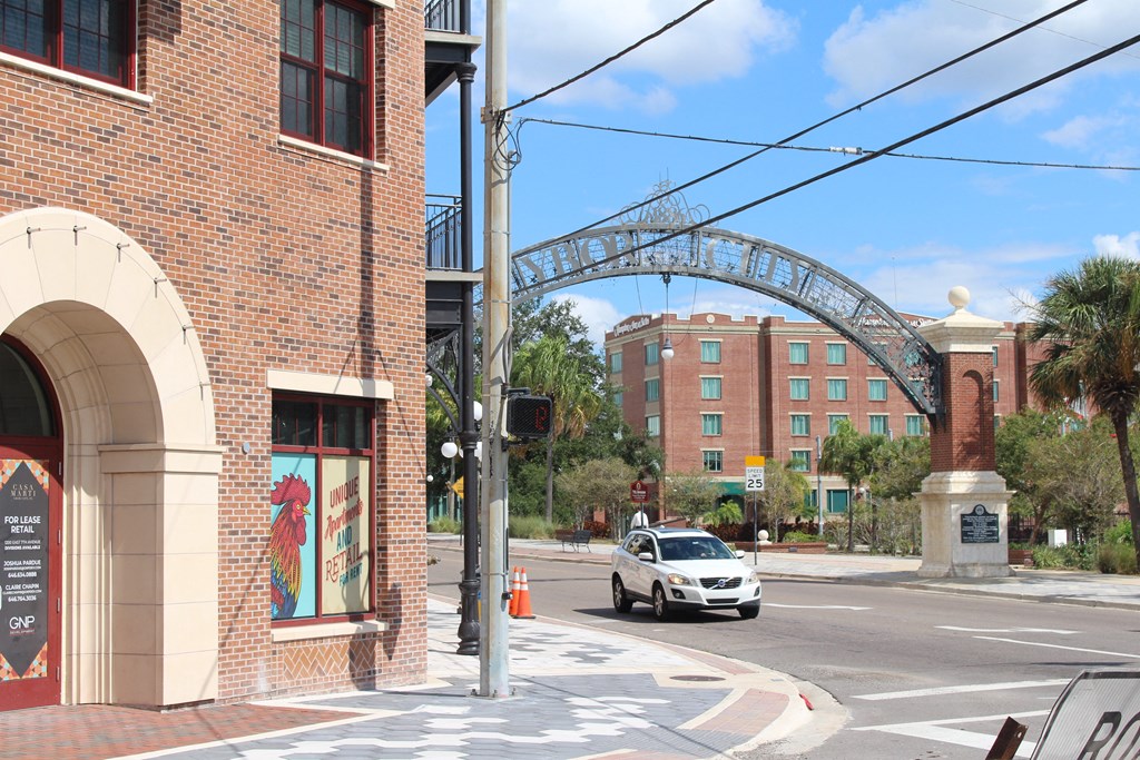 a city street with a car driving under a bridge at Casa Marti, FL, 33605