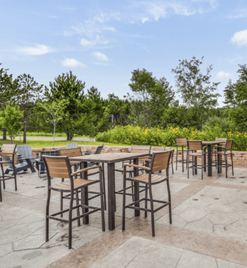 a patio with tables and chairs in a park at Campus Park, Duluth, MN, 55811