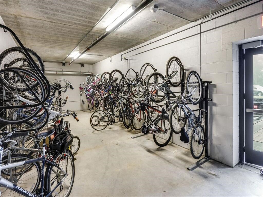 a bunch of bikes are hanging on a wall in a room at Bluestone Lofts, Duluth, MN 55803