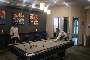 people playing a game of pool at Bluestone Lofts, Minnesota, 55803