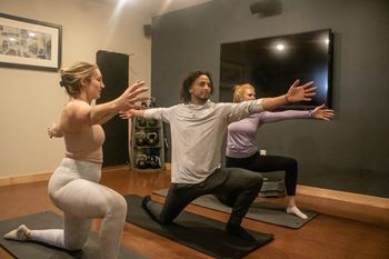 a group of people doing yoga in a room at Bluestone Lofts, Minnesota, 55803
