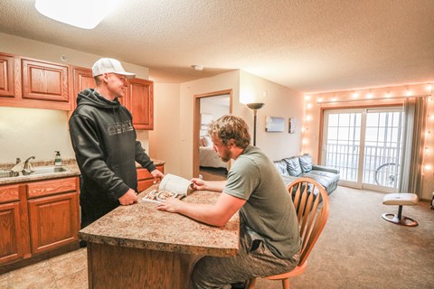 a hallway with a geometric pattern on the wall at Summit Ridge, Duluth