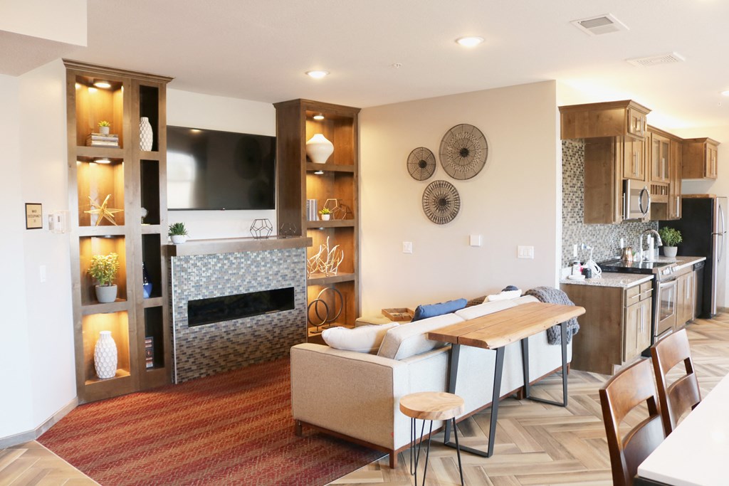 a living room with a couch and a table  at Timber Ridge, Forest Lake, MN, 55025