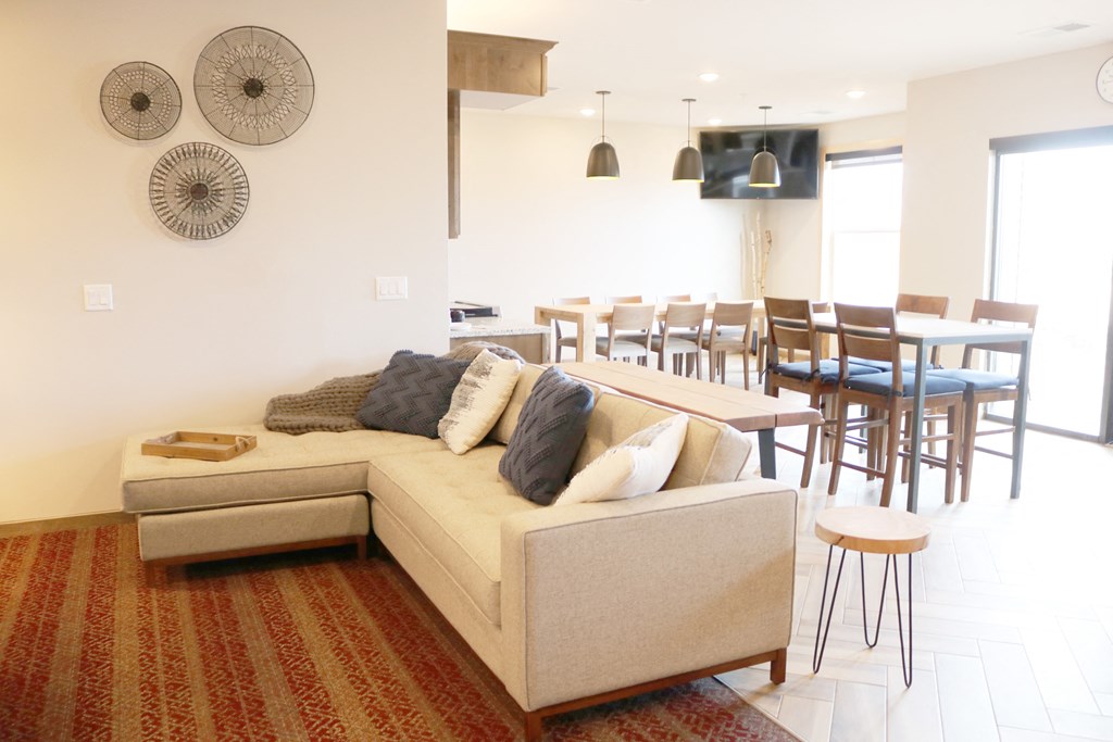 a living room with a couch and a dining room table  at Timber Ridge, Forest Lake, 55025