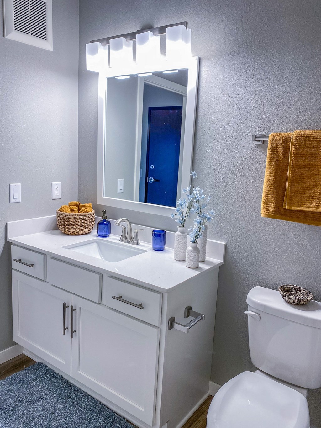 a bathroom with a sink and a mirror and a toilet  at Timber Ridge, Minnesota