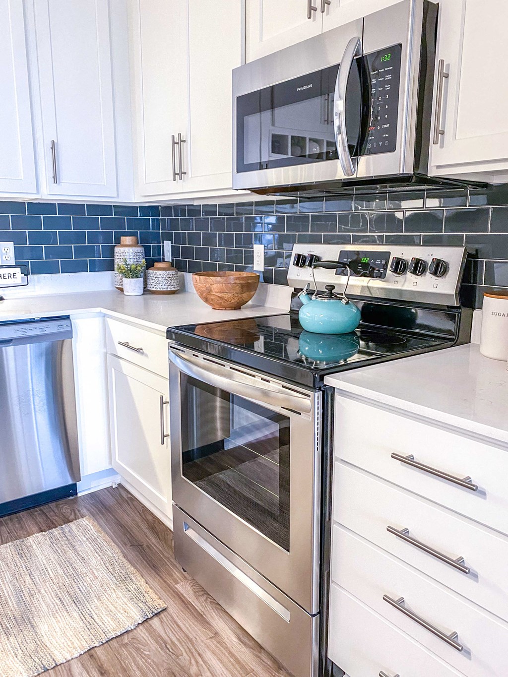 a kitchen with stainless steel appliances and white cabinets  at Timber Ridge, Minnesota, 55025
