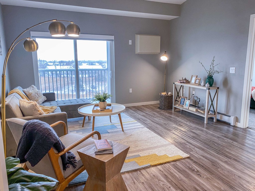 a living room with a large window and a couch  at Timber Ridge, Minnesota