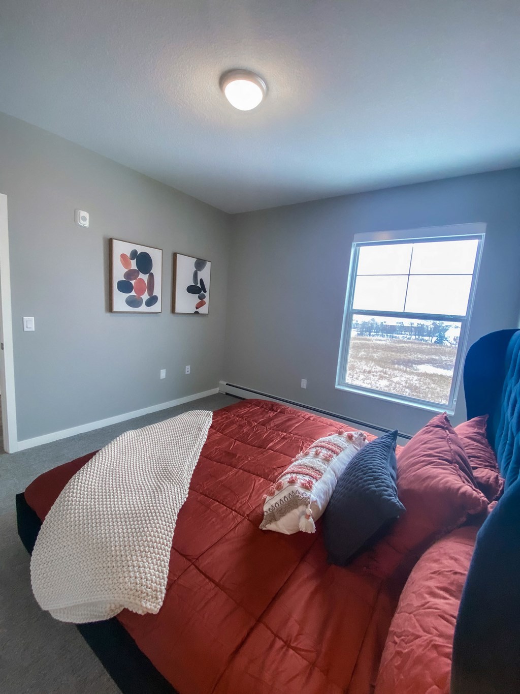 a bedroom with a bed and a window  at Timber Ridge, Forest Lake, MN