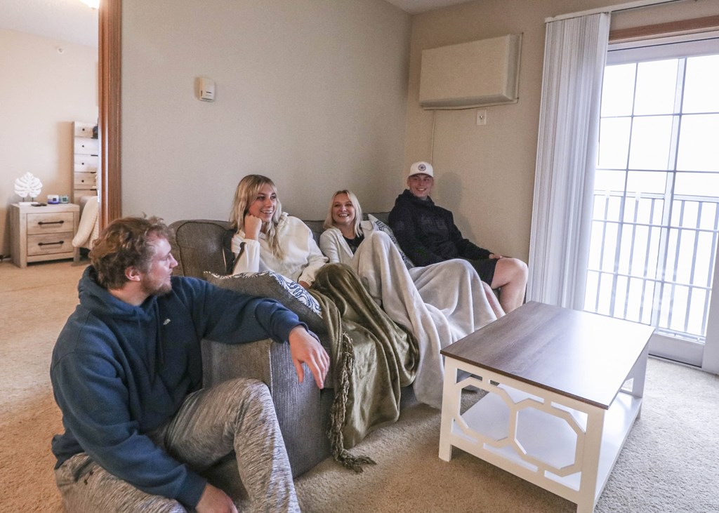 people sitting on a couch in a living room at Boulder Ridge, Duluth, 55811