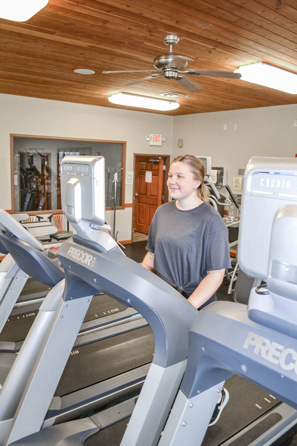 a woman walking on a treadmill in a gym at Boulder Ridge, Duluth, MN