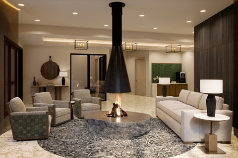 A modern living room with a fireplace and comfortable seating.