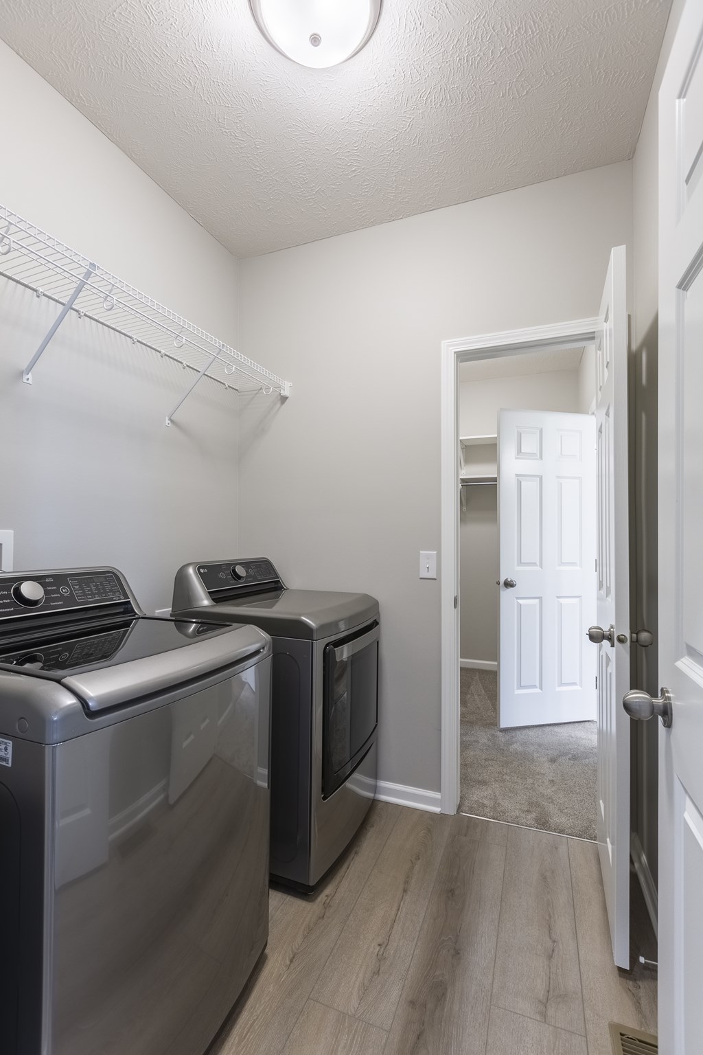 A laundry room with a washer and dryer.