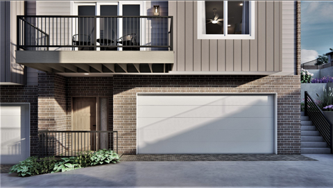 A modern house with a balcony and a garage.