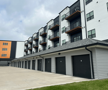 A long building with a lot of garage doors.