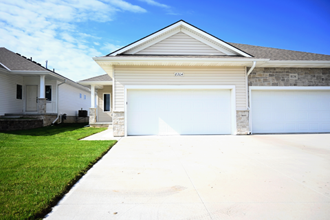 A two-car garage is attached to a house.