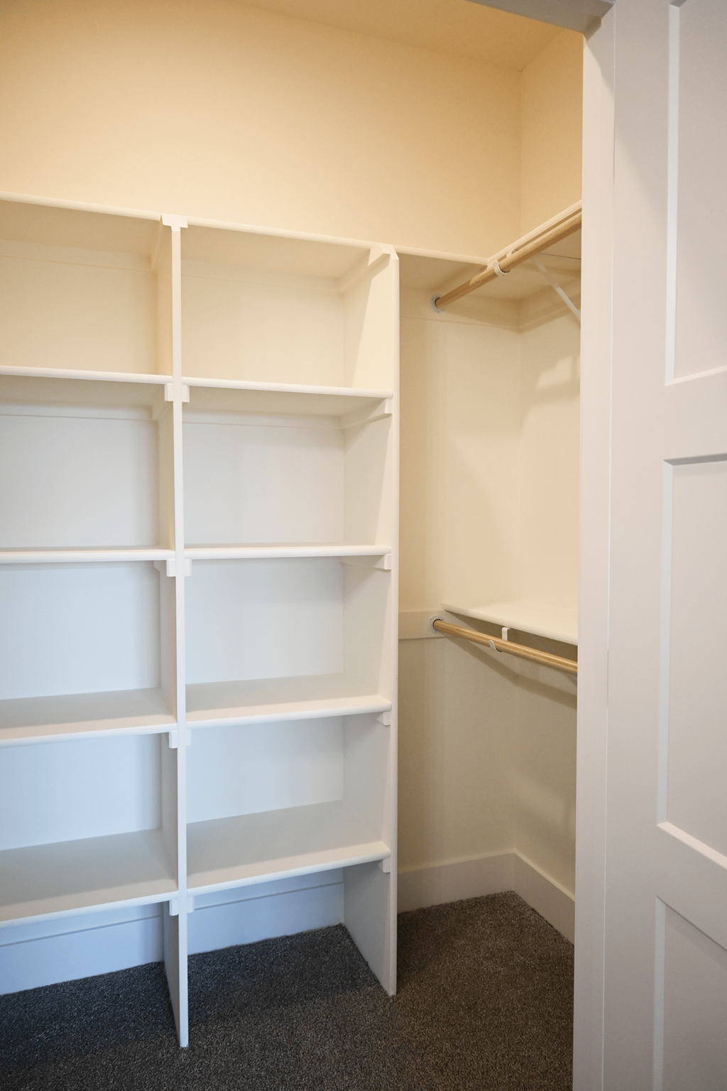 Empty white shelves in a room.