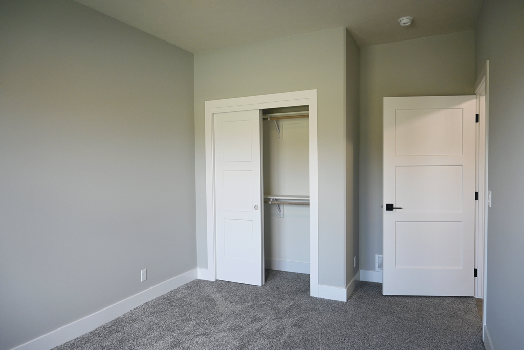 A room with two doors, one of which is open.