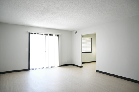 A room with a sliding door and a window.