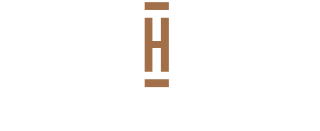 A logo with a large letter H and the words Heartland Flats.