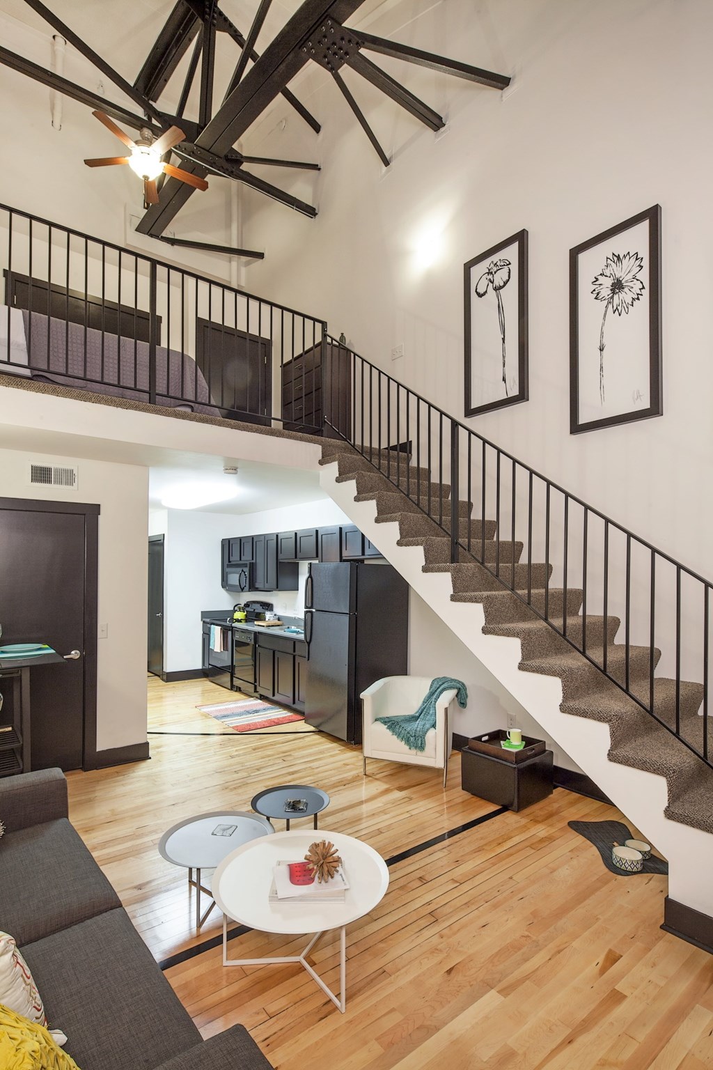 A living room with a grey couch and a white coffee table.