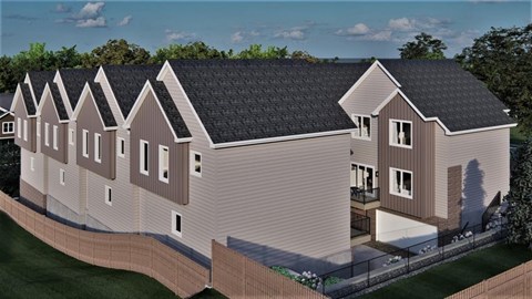 A modern house with a grey and brown exterior and a black roof.