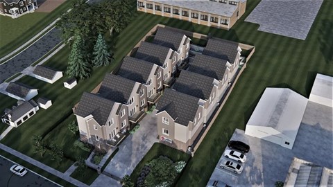 A rendering of a building complex with multiple buildings and a parking lot.