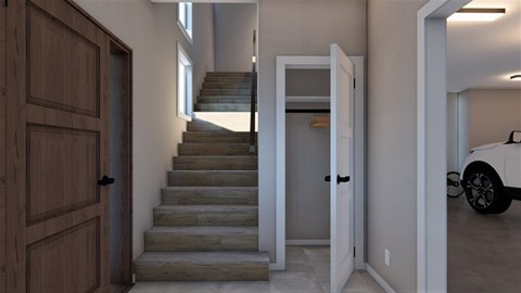 A white car is parked in the hallway of a house.