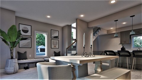 A modern living room with a staircase and a dining area.