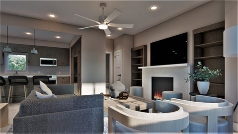 A modern living room with a grey sofa and a fireplace.