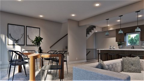 A living room with a couch, chairs, and a dining table.