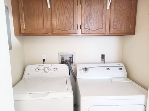A washer and dryer in a small laundry room.