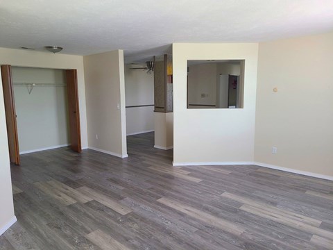 A room with a grey floor and white walls.