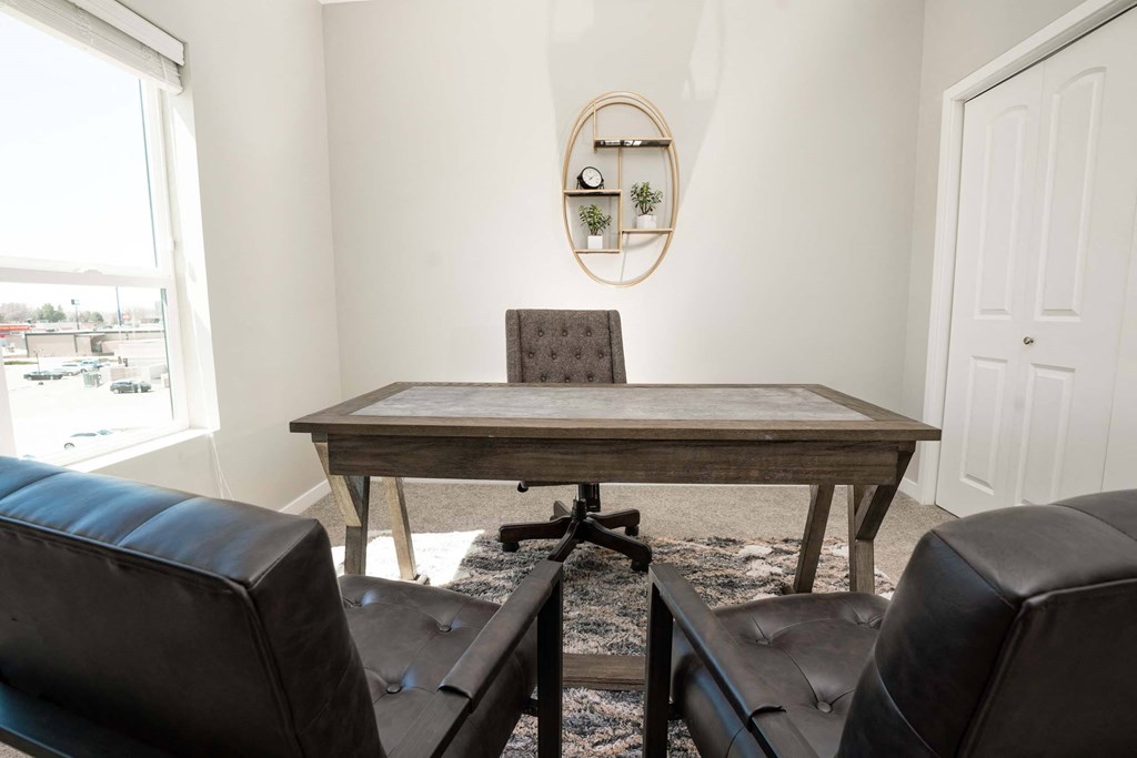 A room with a table and two chairs.