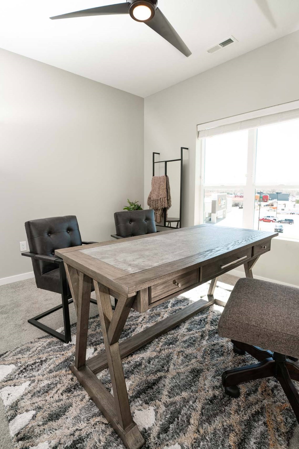 A room with a table and chairs.