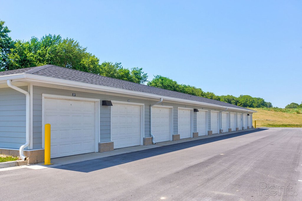 A long row of garage doors are closedat Lofts at Fox Ridge, Raymore, Missouri