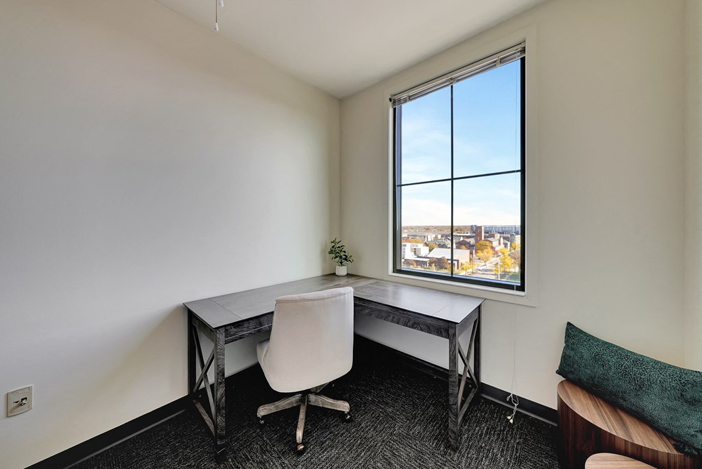 an office space with a desk and a window at Parkhaus Apartments, Lincoln, NE