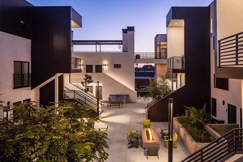 A modern building with a courtyard and staircases.