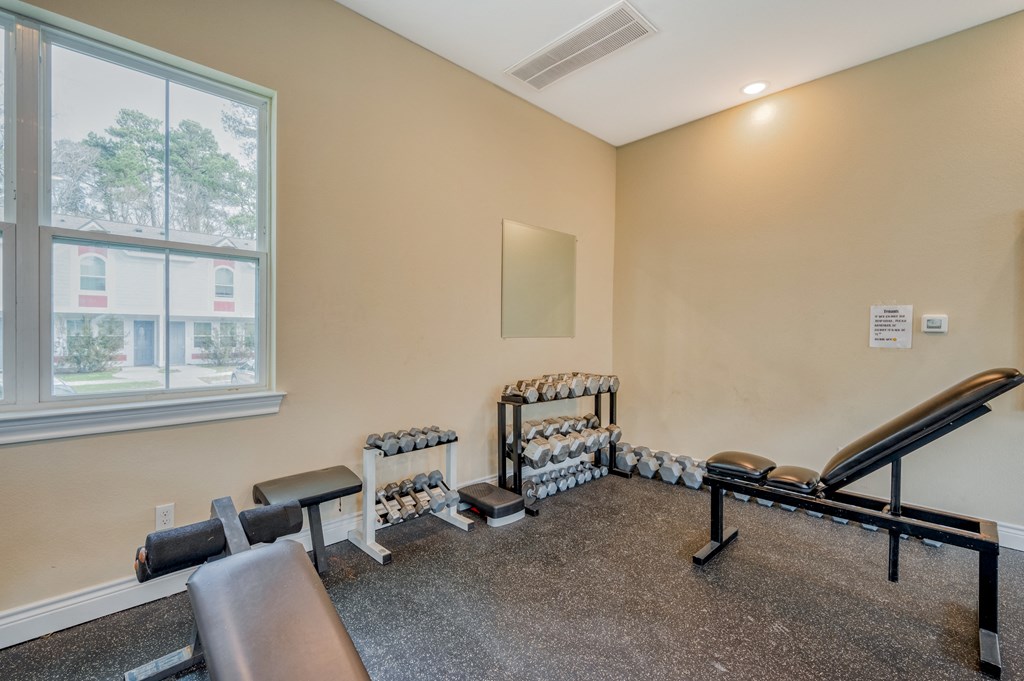 the gym with weights and cardio equipment at the preserve at greatstone