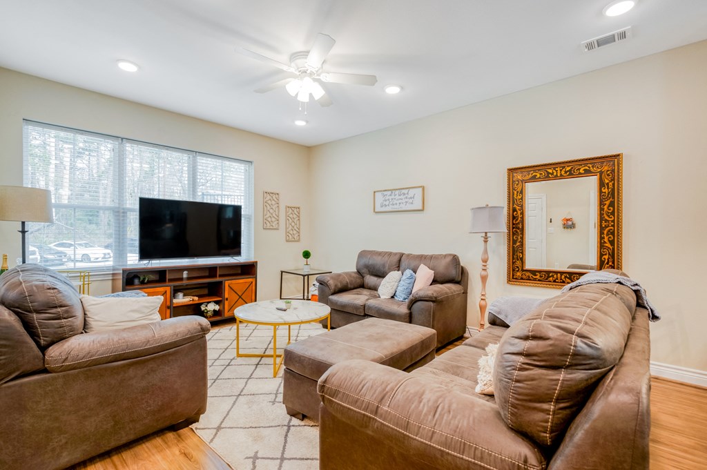 a living room with couches and a tv
