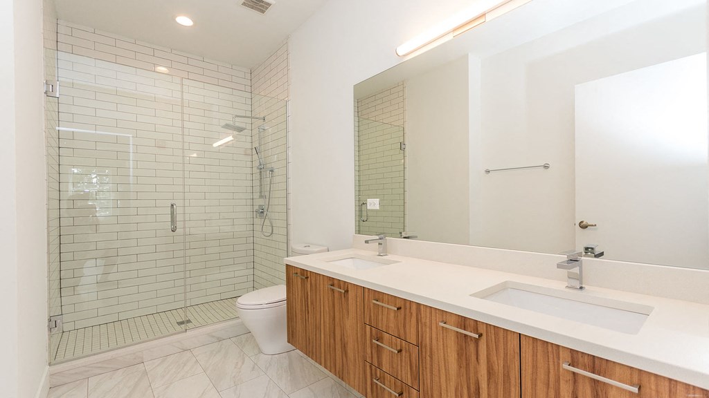 a bathroom with a sink toilet and a shower