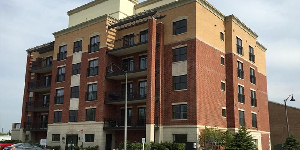 a tall brick building with a lot of windows at Countryside 10765, Countryside, IL, 60525